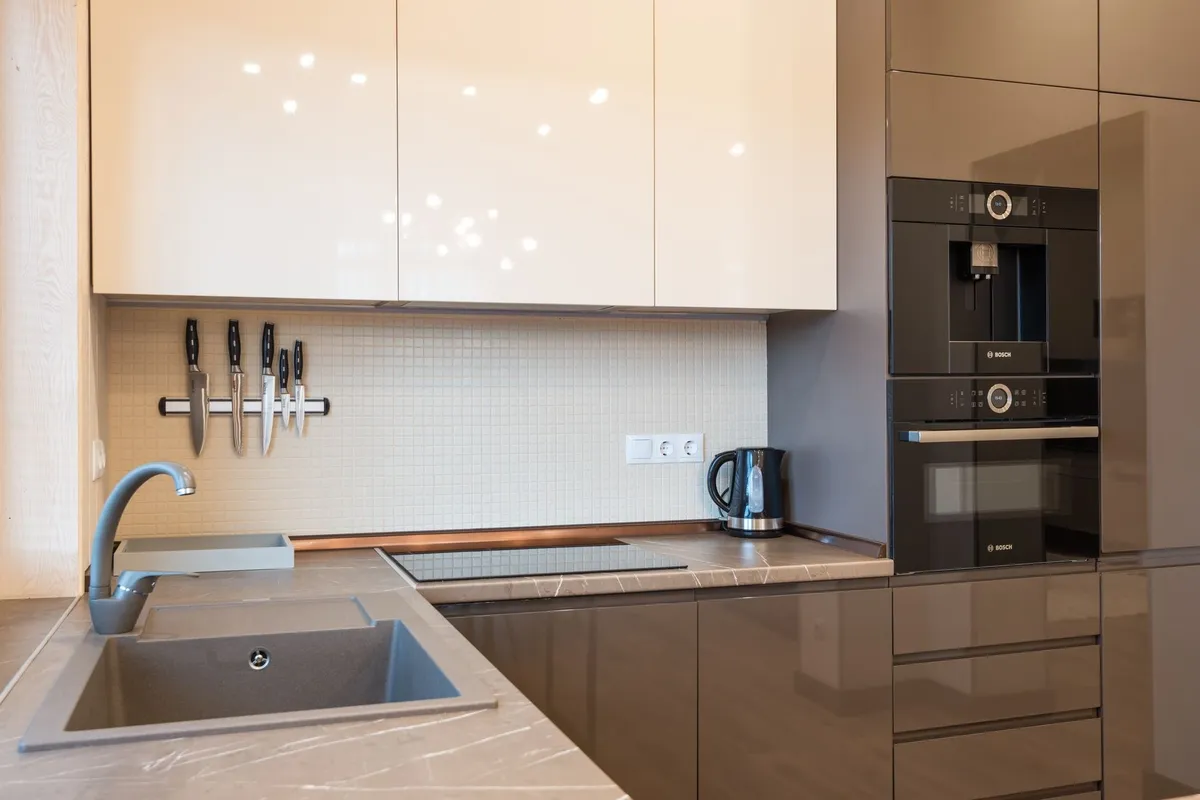 A modern kitchen with minimalist furniture and sleek appliances, reflecting the importance of design in attracting customers.